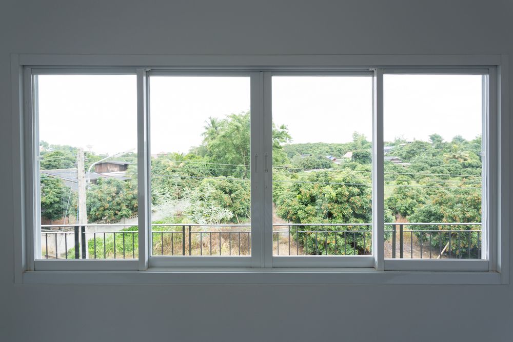 Wide Window With White Frames — ALUBEST Windows & Doors In Southport, QLD