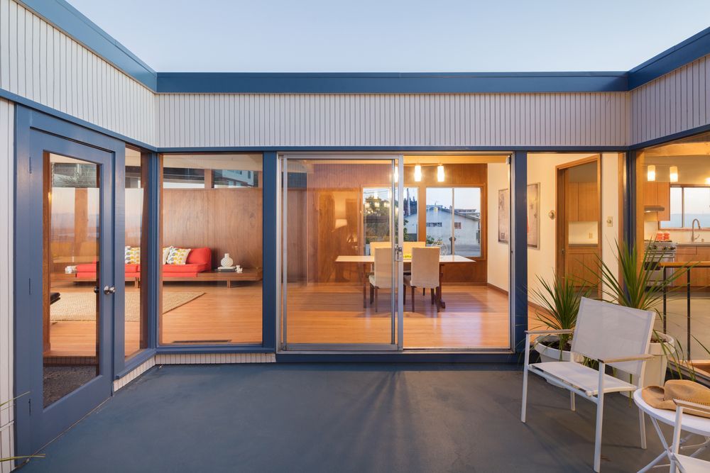 Modern Patio With Glass Doors, Warm-lit Interior — ALUBEST Windows & Doors In Southport, QLD