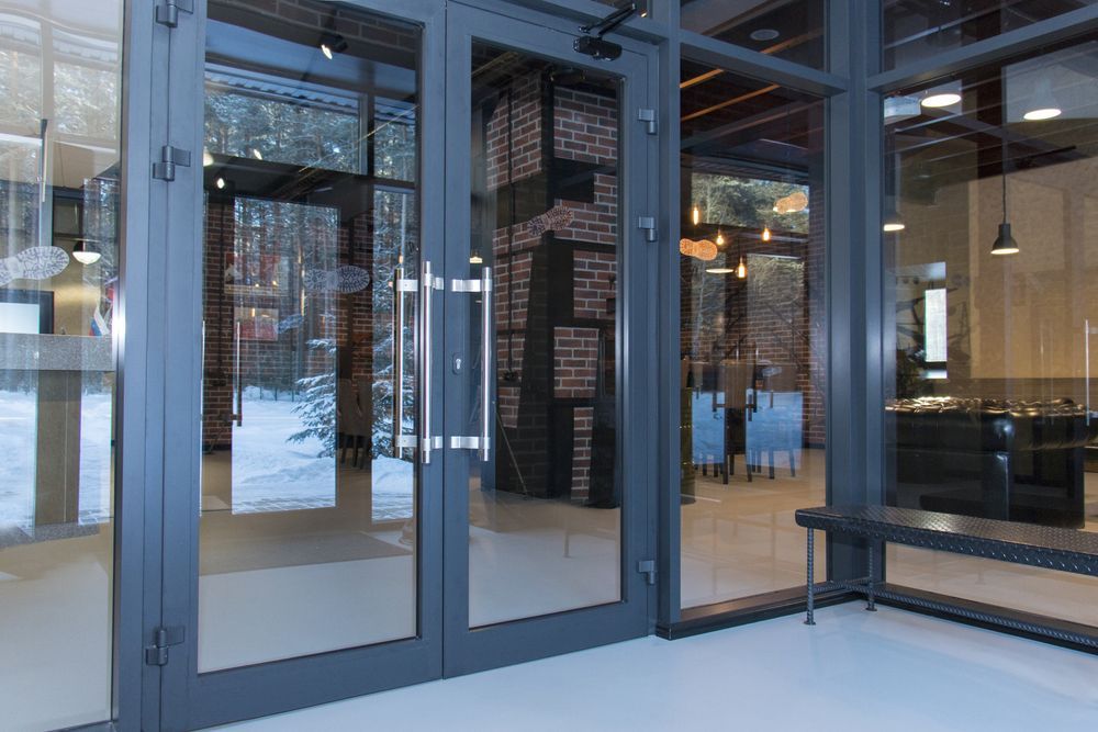 Glass Storefront Doors Opening Into a Modern Office — ALUBEST Windows & Doors In Southport, QLD