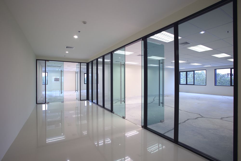 Empty Modern Office Corridor With Glass Walls and Glossy White Floor — ALUBEST Windows & Doors In Southport, QLD