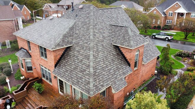 Drone Shot Of The Top Of A Roof Fixed By A Roofing Contractor In Virginia Beach, VA Drone Shot Of The Top Of A Roof Fixed By A Roofing Contractor In Virginia Beach, VA