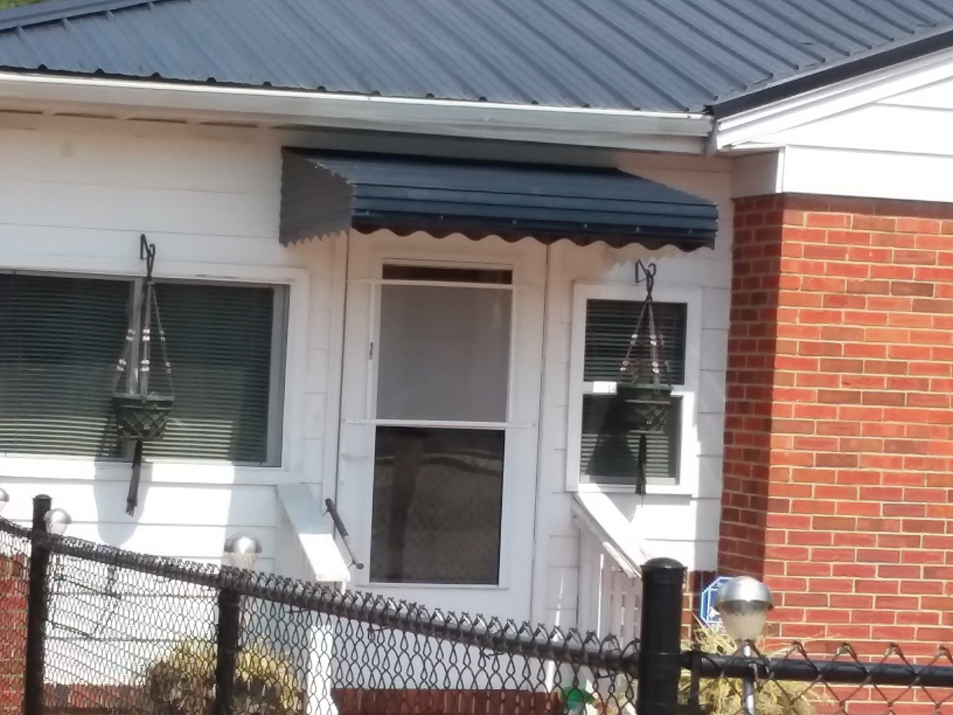 Black Aluminum awning installed on home