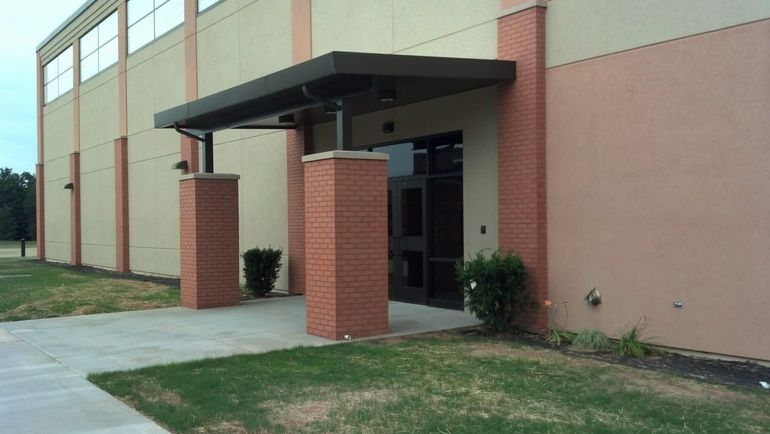 Bronze awning with brick columns