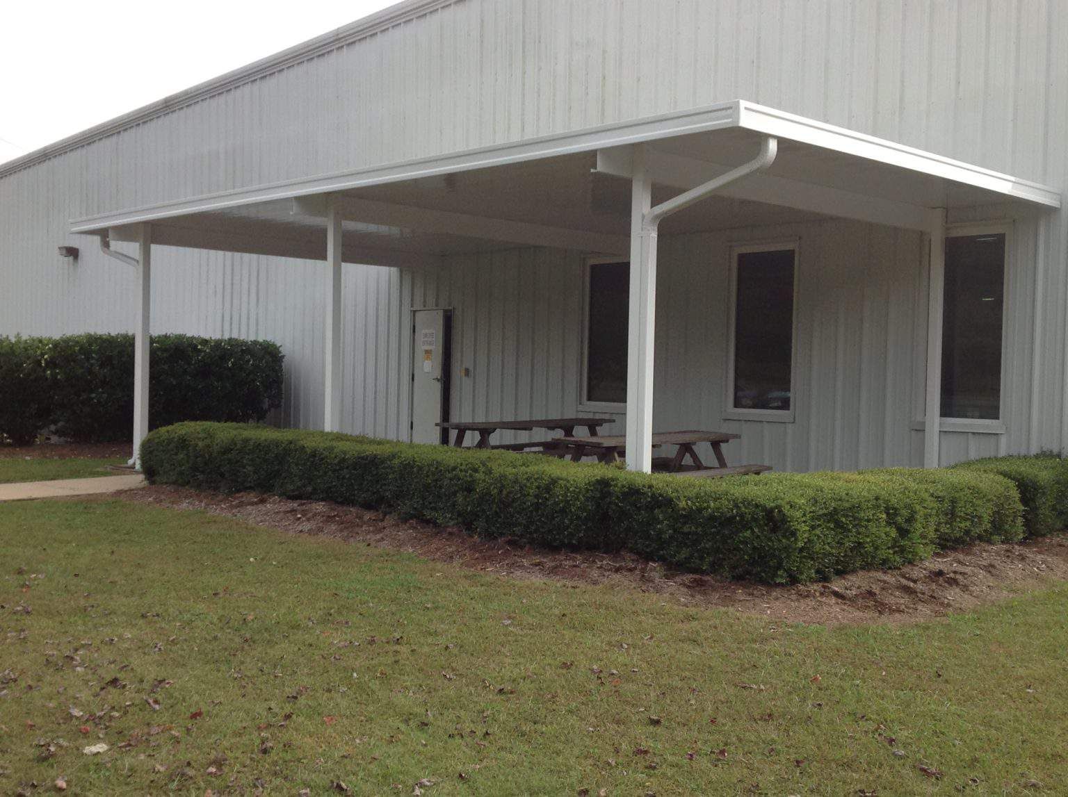 Post supported aluminum awning over break area