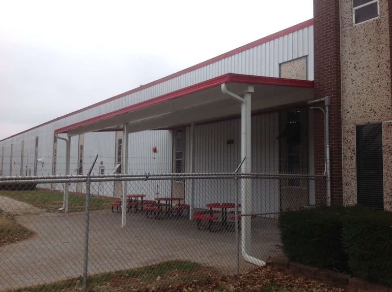 Post supported aluminum awning over break area