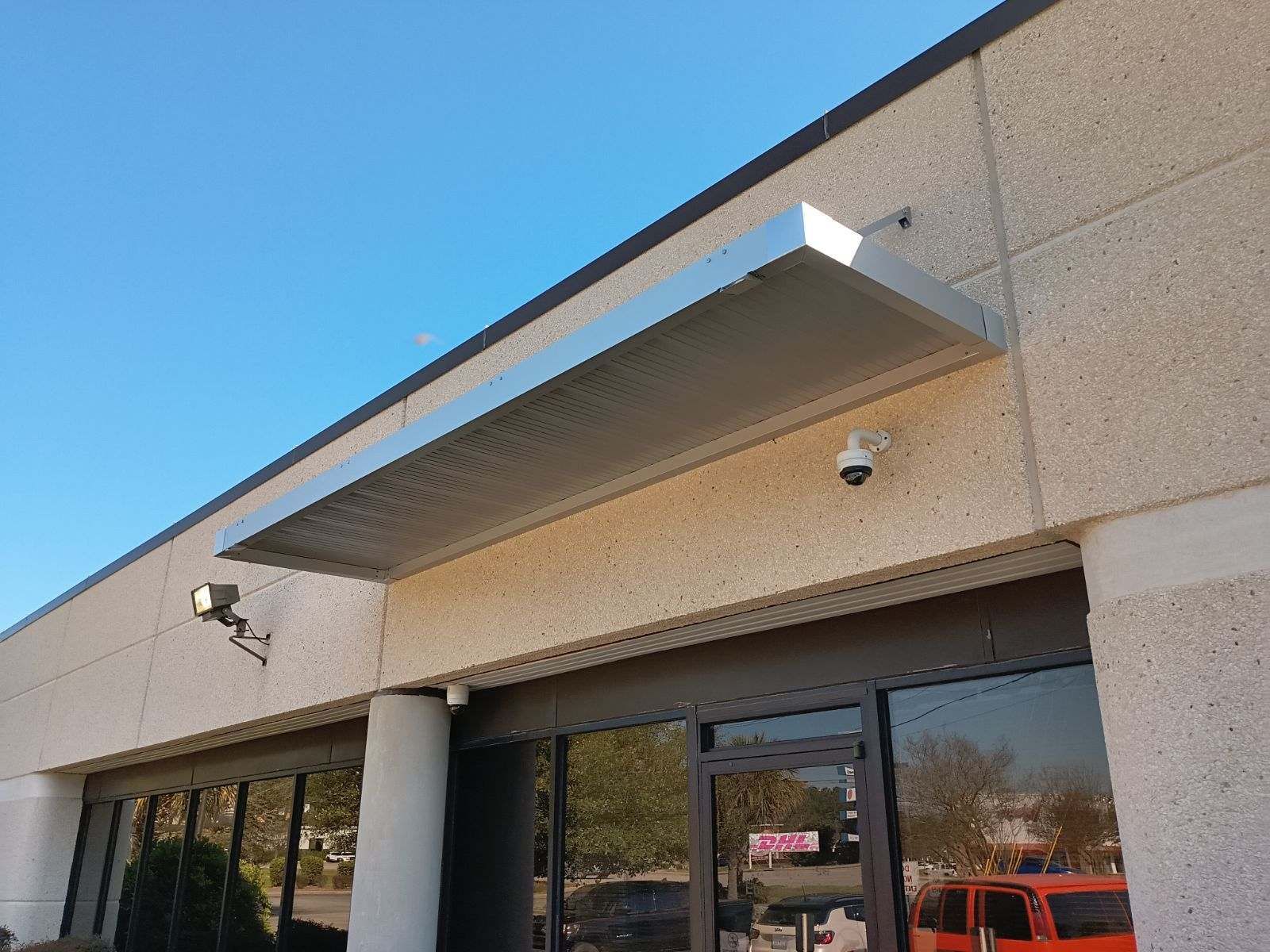 Silver metallic rod canopy awning with extruded gutter