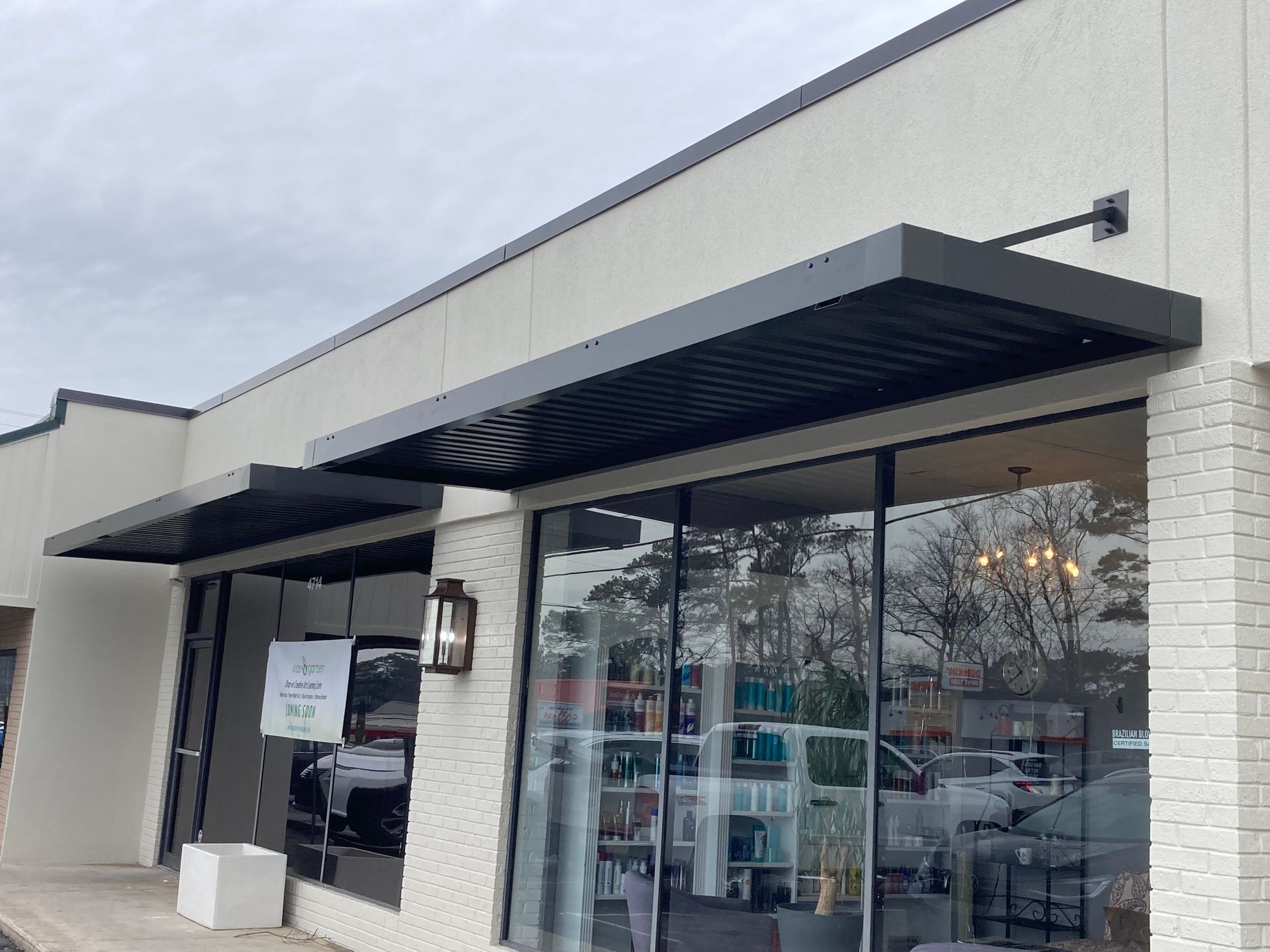 Rod canopy awning with extruded gutter and square mounting hardware