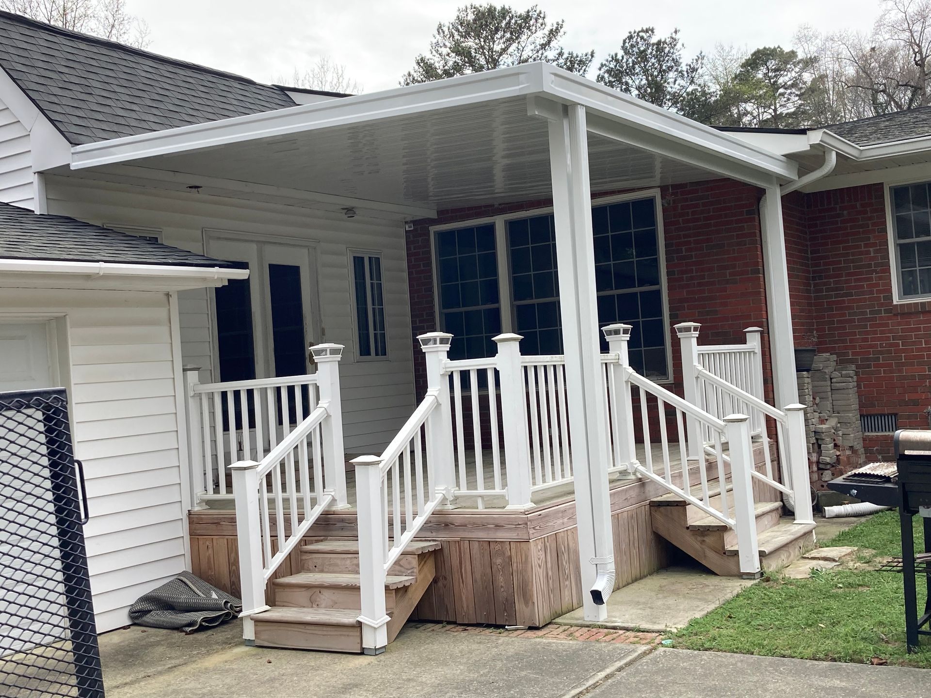 Aluminum patio awning installed over porch