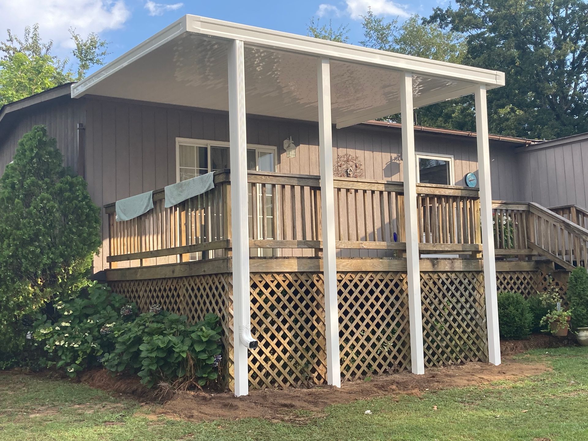 Aluminum patio awning installed over deck