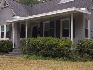 Post supported aluminum awning over front porch