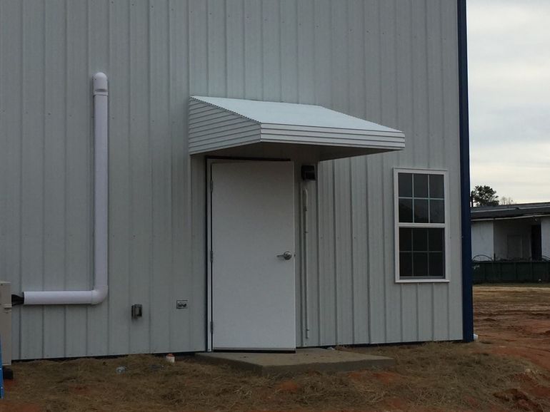 White aluminum awning with straight valance