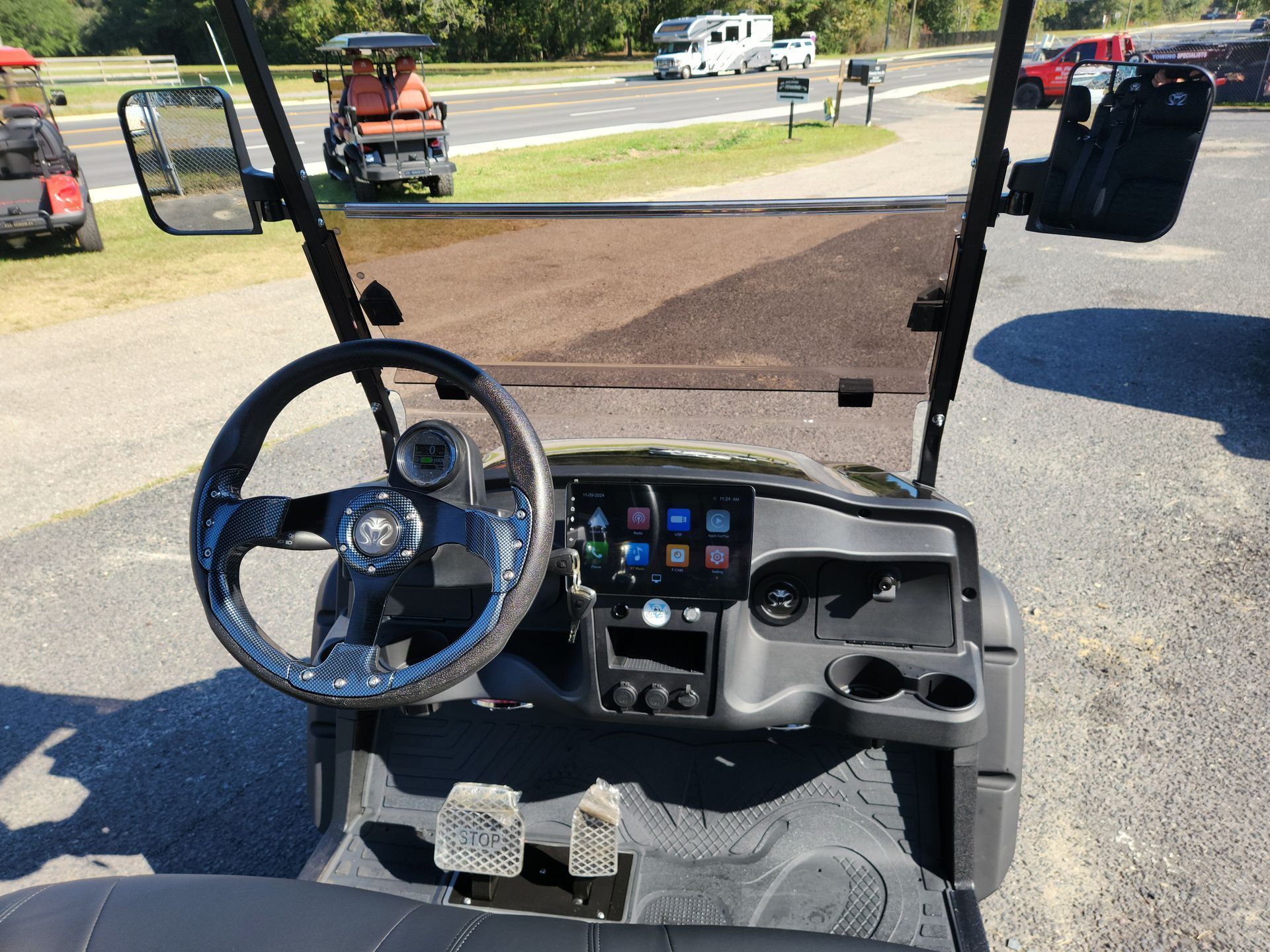 A golf cart is parked on the side of the road