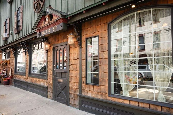A building with a lot of windows and a sign that says ' bakery ' on it.