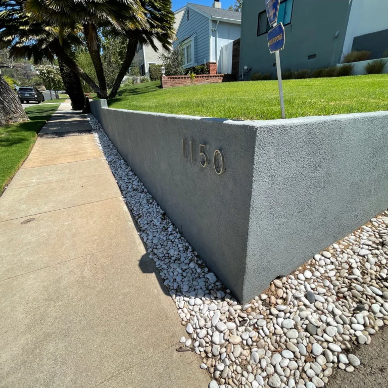 A concrete wall with the number 150 on it. By C1 Foundations in Ocala, Fl