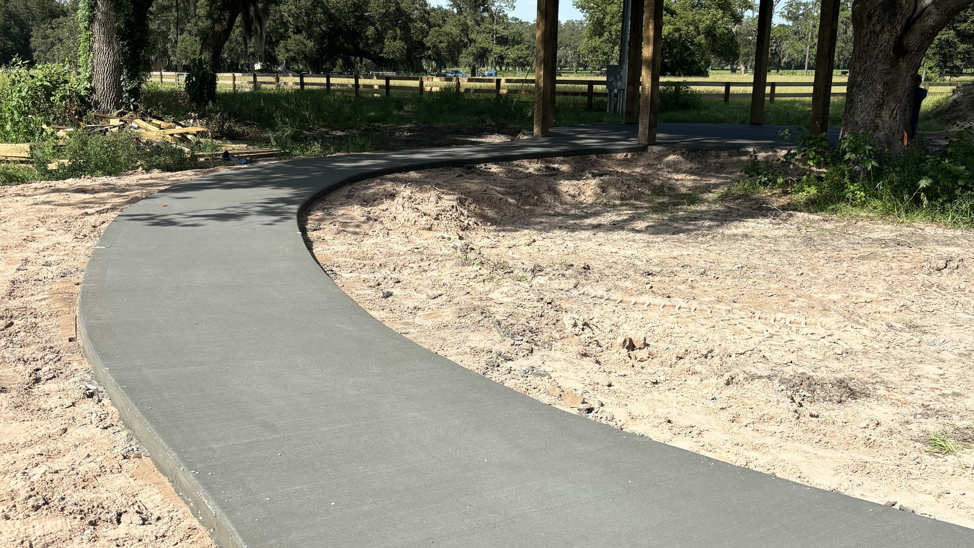Concrete walkway leading to a residential home entrance in Ocala, FL