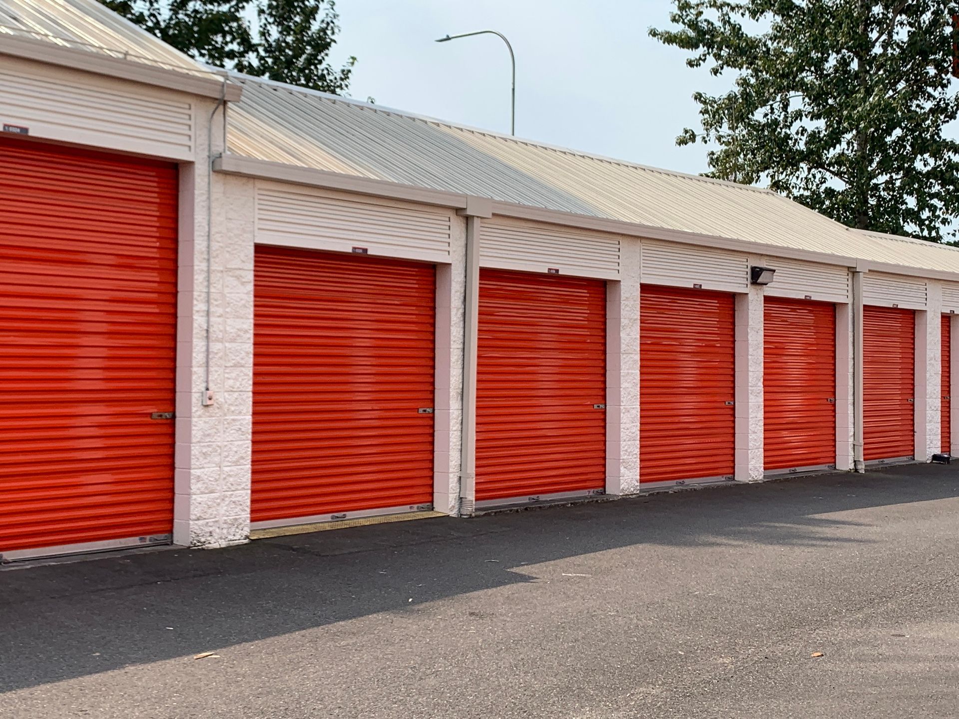 Orange metal garage doors on a building