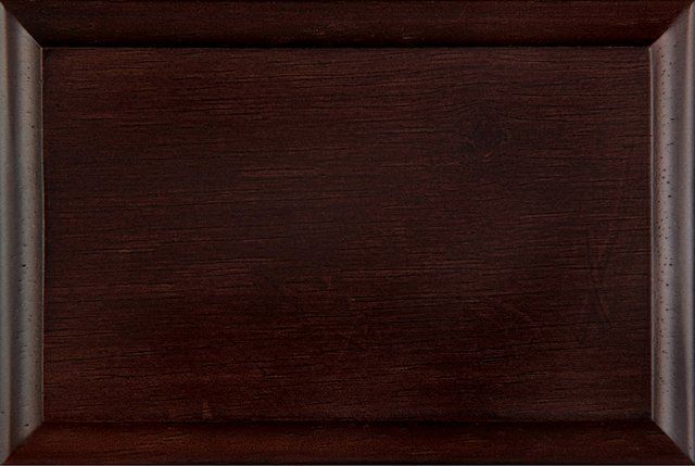 A close up of a piece of wood with a sample stain - espresso