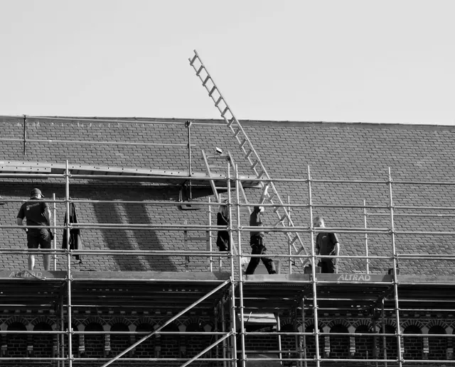 Men doing Roof Repairs