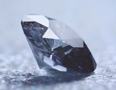 Cut Diamond on Grey Surface
