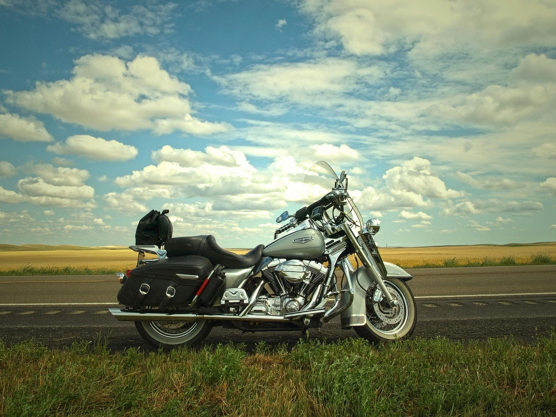 A motorcycle standing up by the road