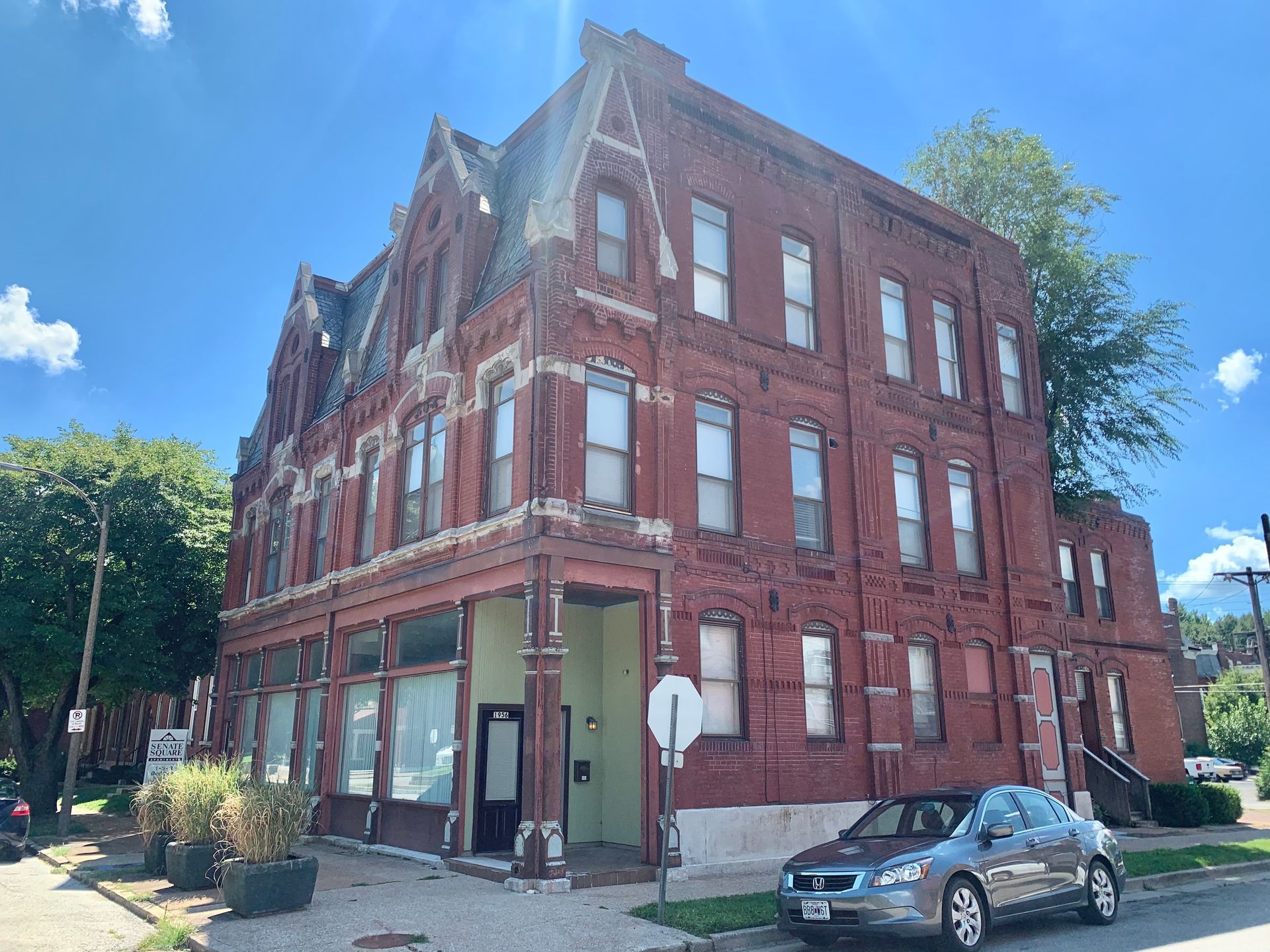 Red brick multifamily apartment building on a sunny day in St. Louis
