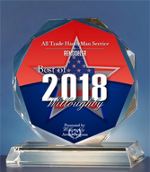 A glass trophy with a red , white and blue star on it.