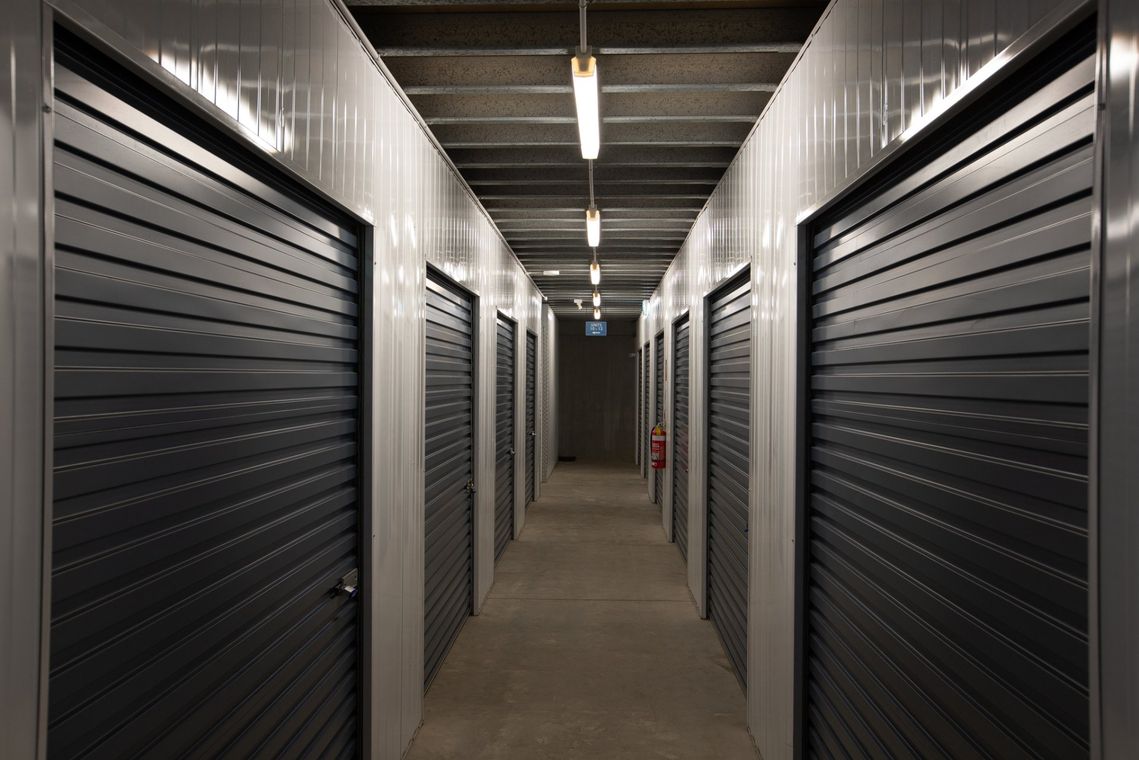 Hallway With White Storage Units — Storage Facility In Kurri Kurri, NSW