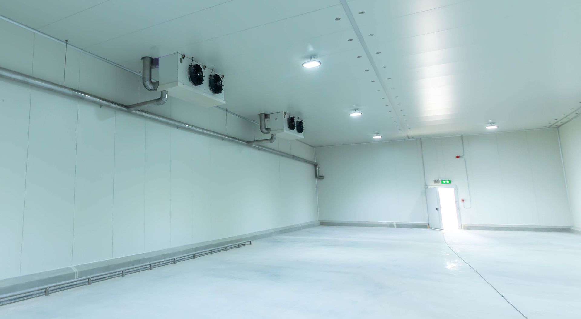 Industrial refrigeration system inside a large freezer room.