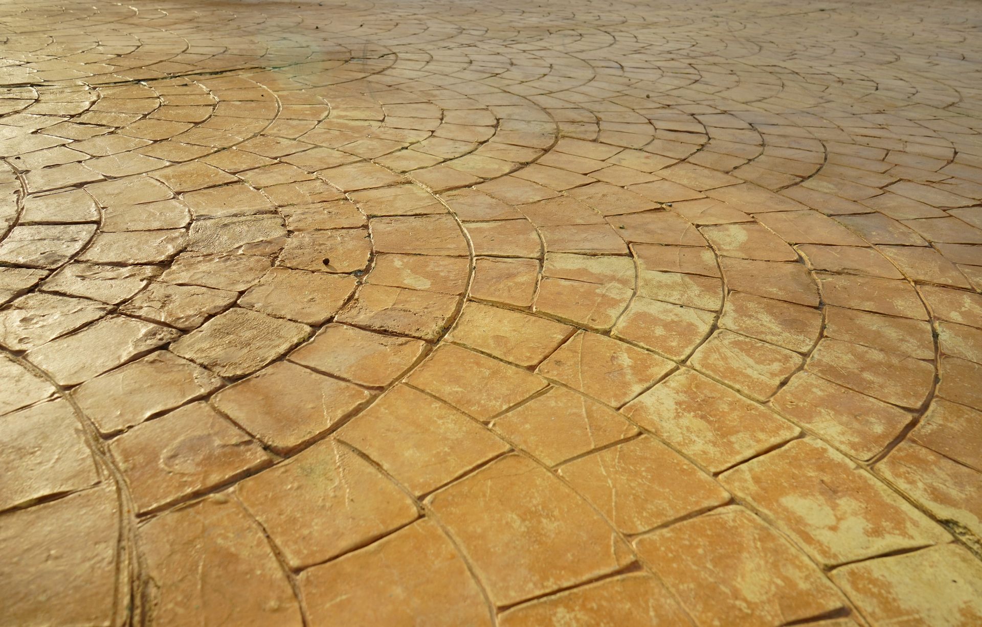 A close up of a brick floor with a pattern