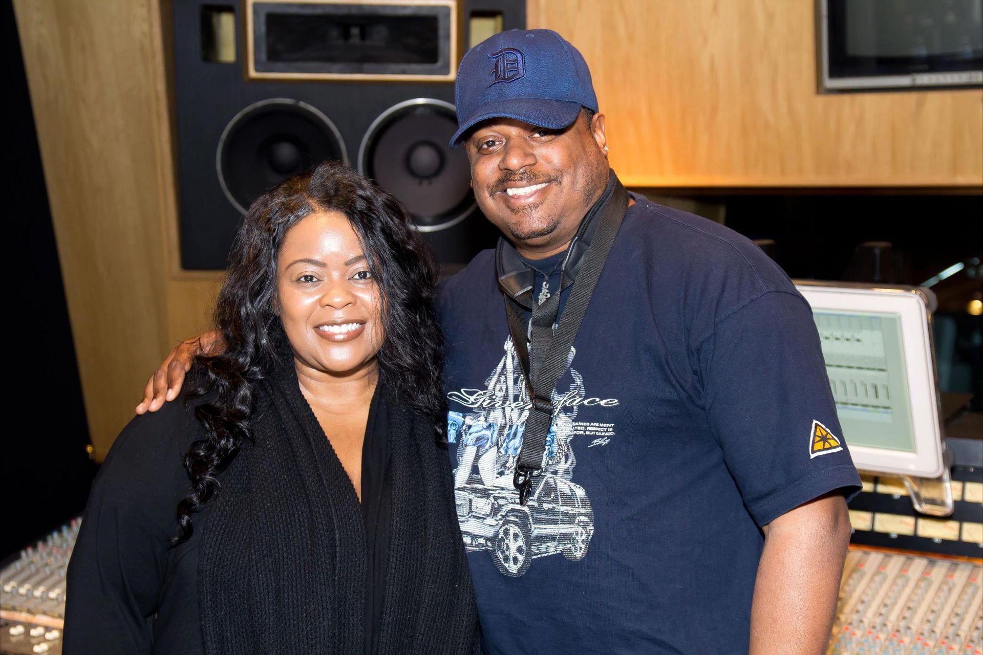 Deon Yates and Maysa are posing for a picture in a recording studio