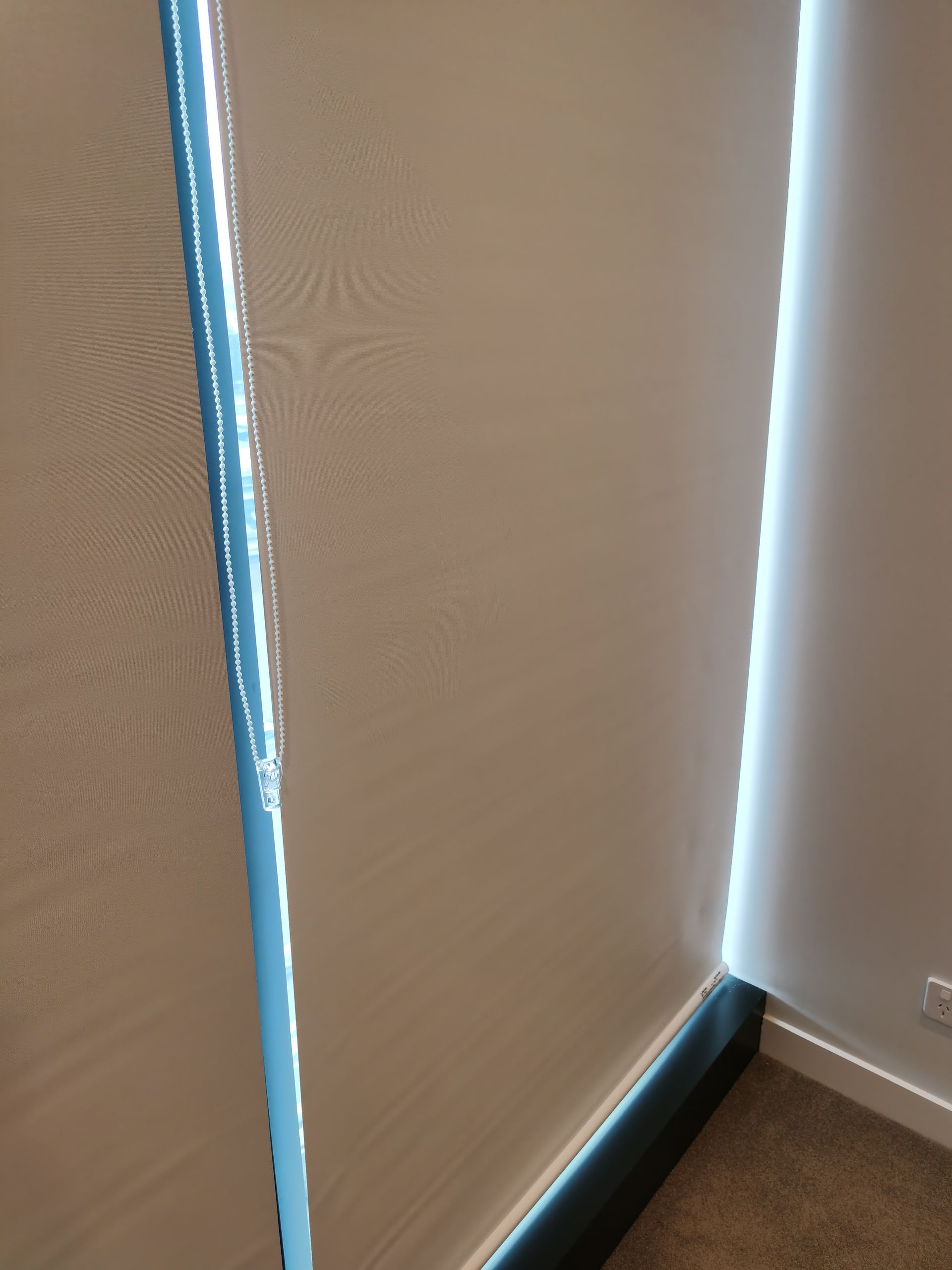 A close up of a window with blinds on it in a room.