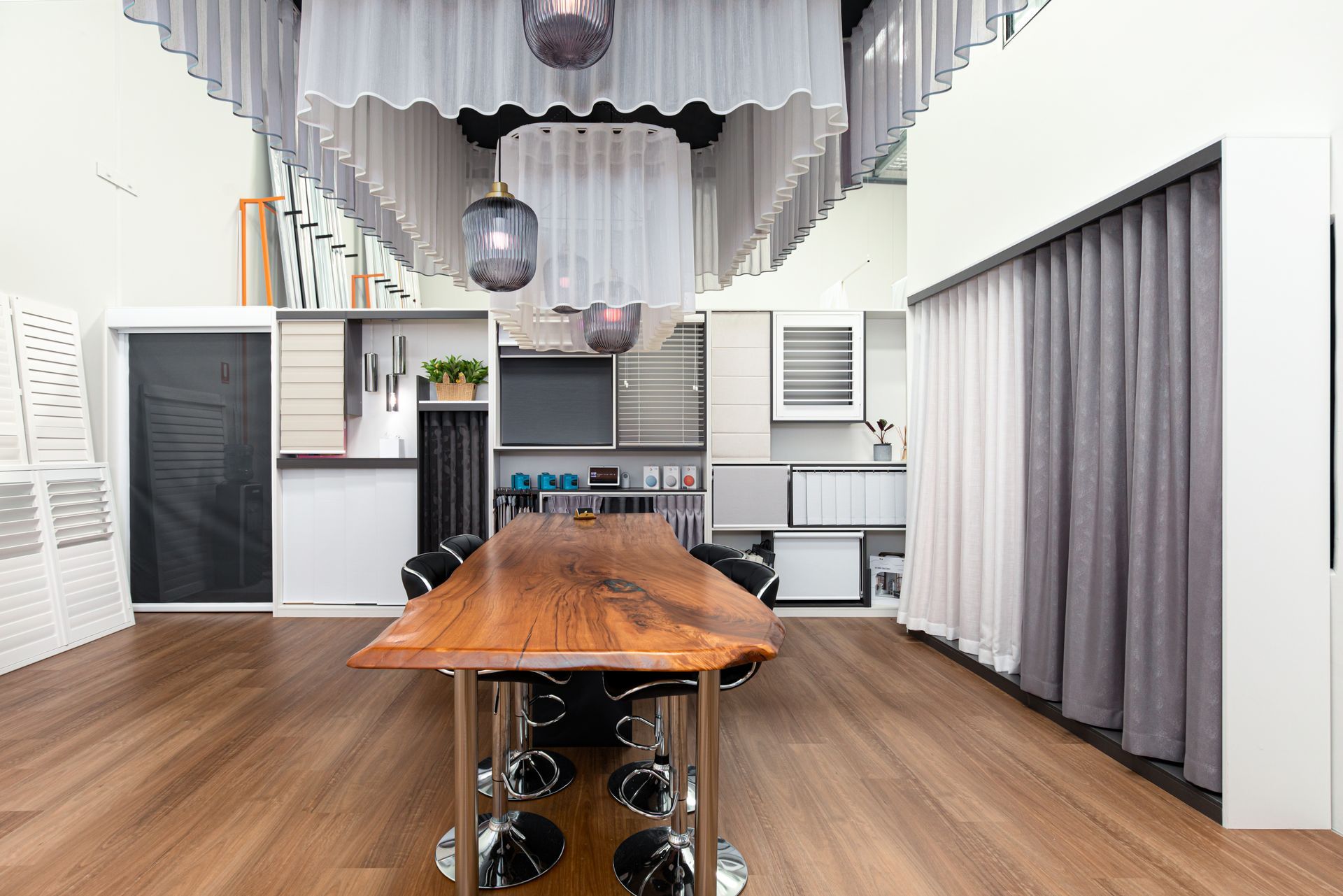 There is a large wooden table in the middle of the room.