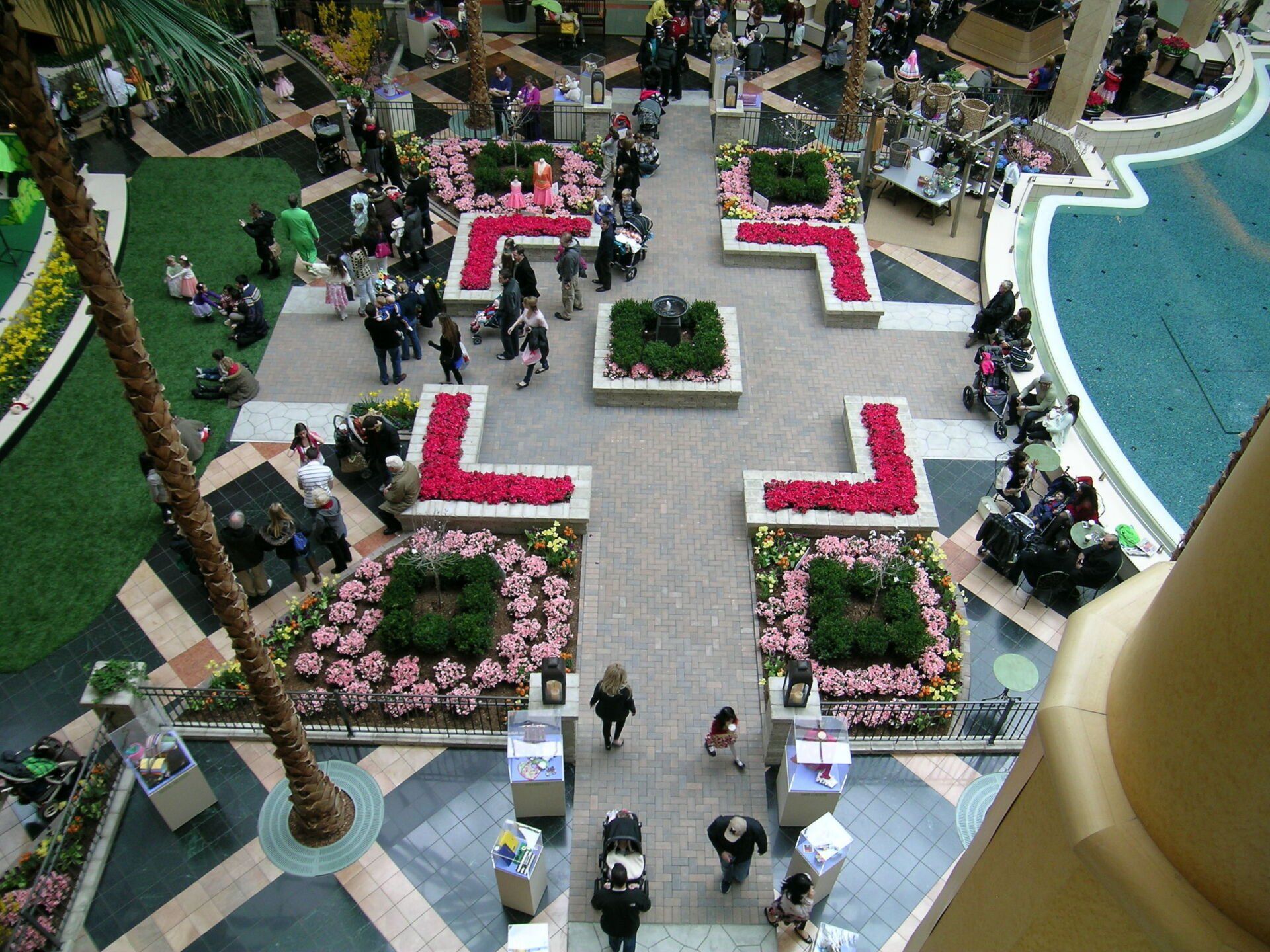 An aerial view of a mall with flowers and people