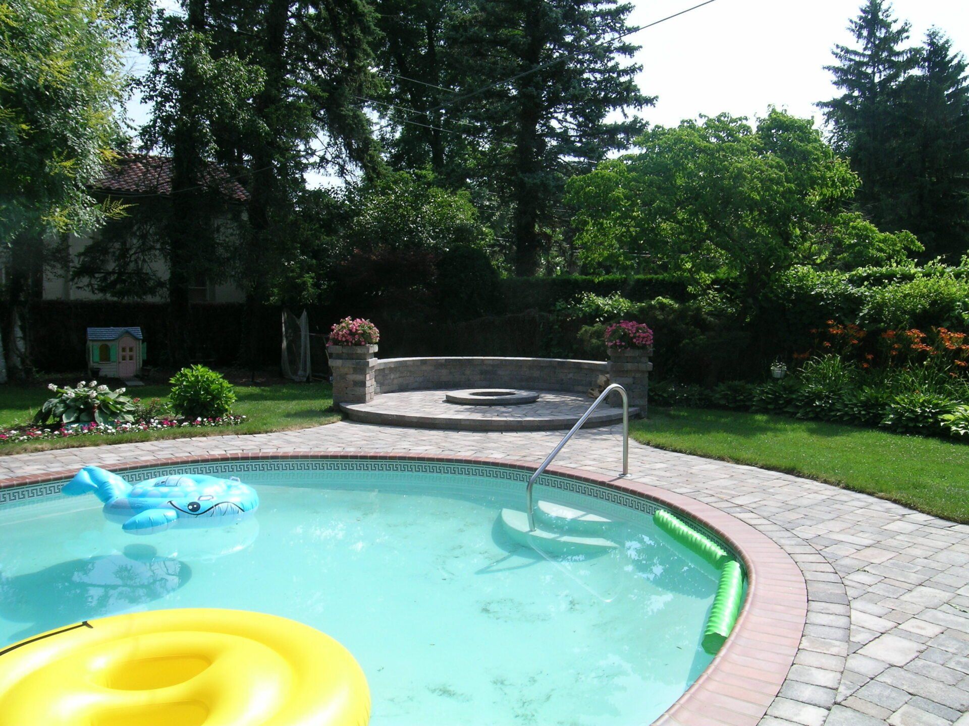 A swimming pool with a yellow float in it