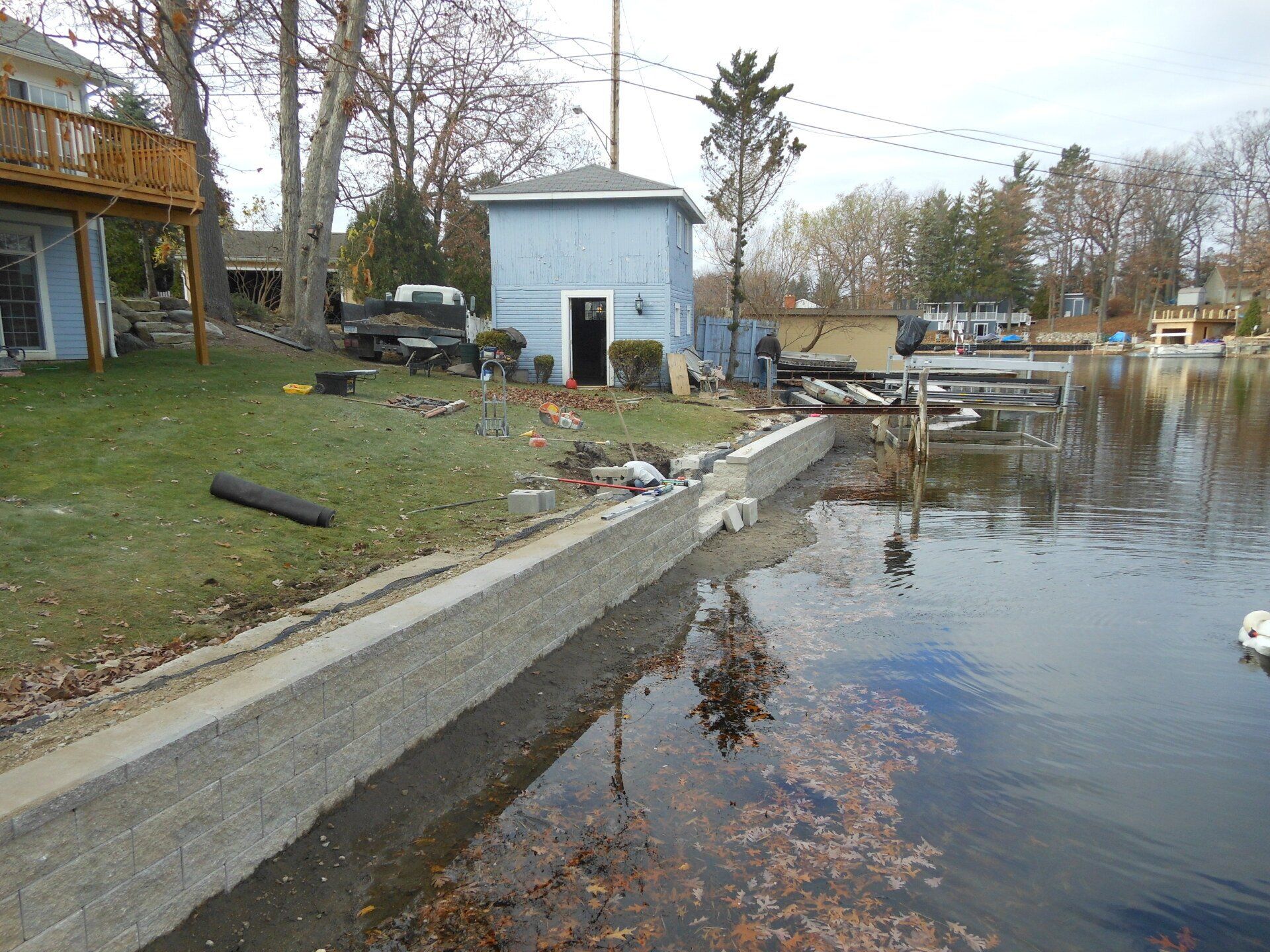 A house sits next to a body of water