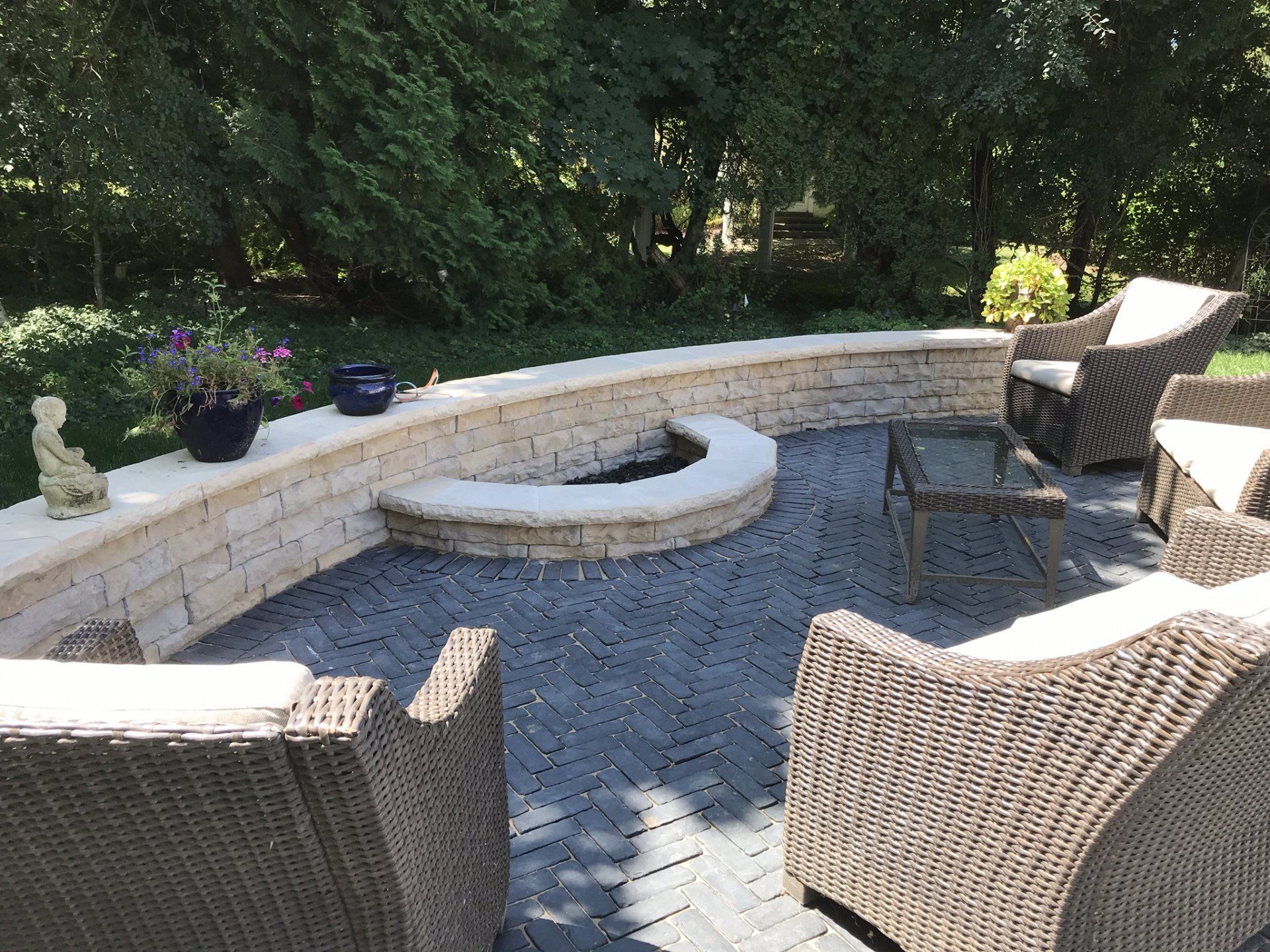 There is a fire pit in the middle of the patio.