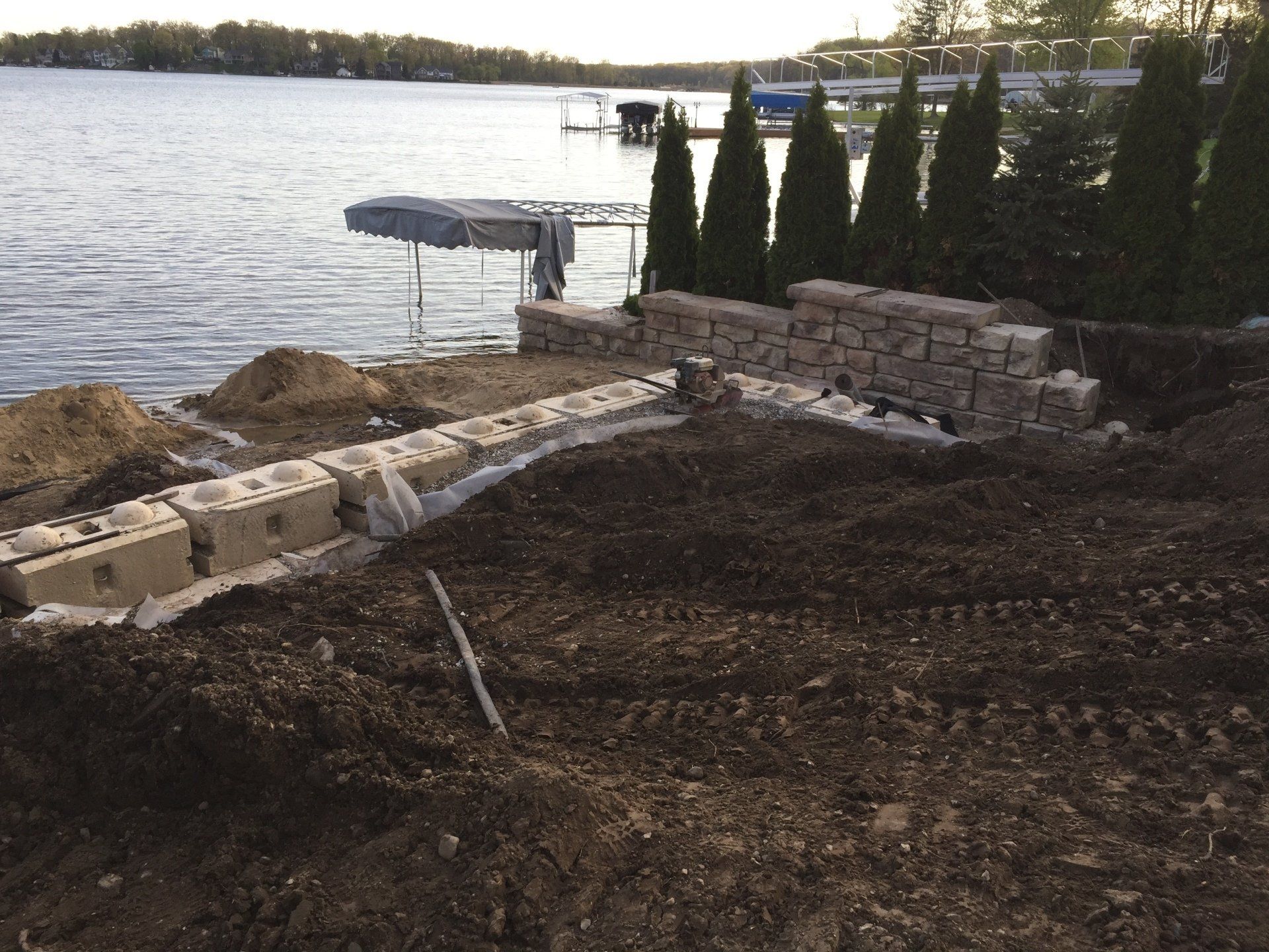 A dock is being built on the shore of a lake