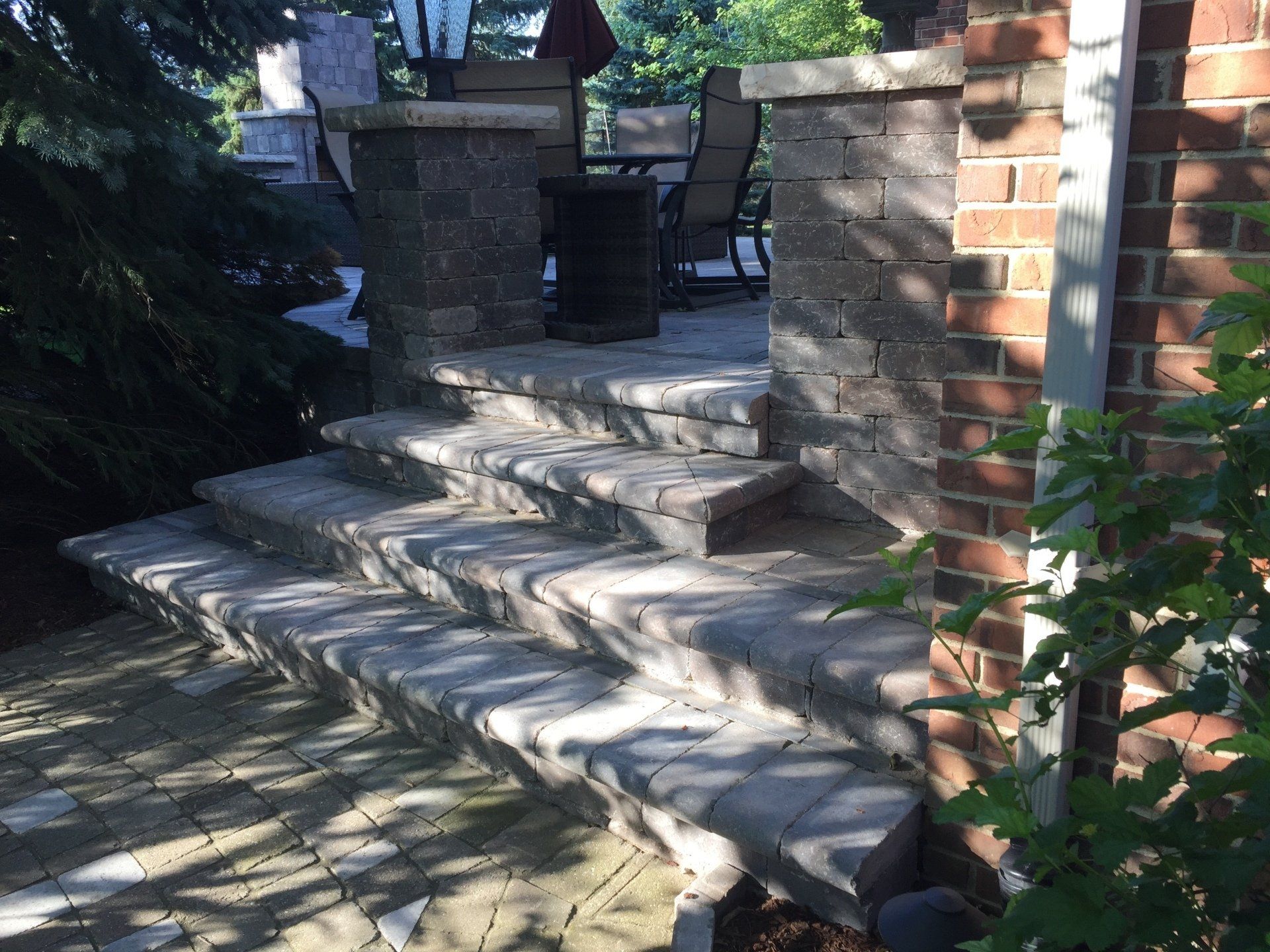 A set of stairs leading up to a brick building.