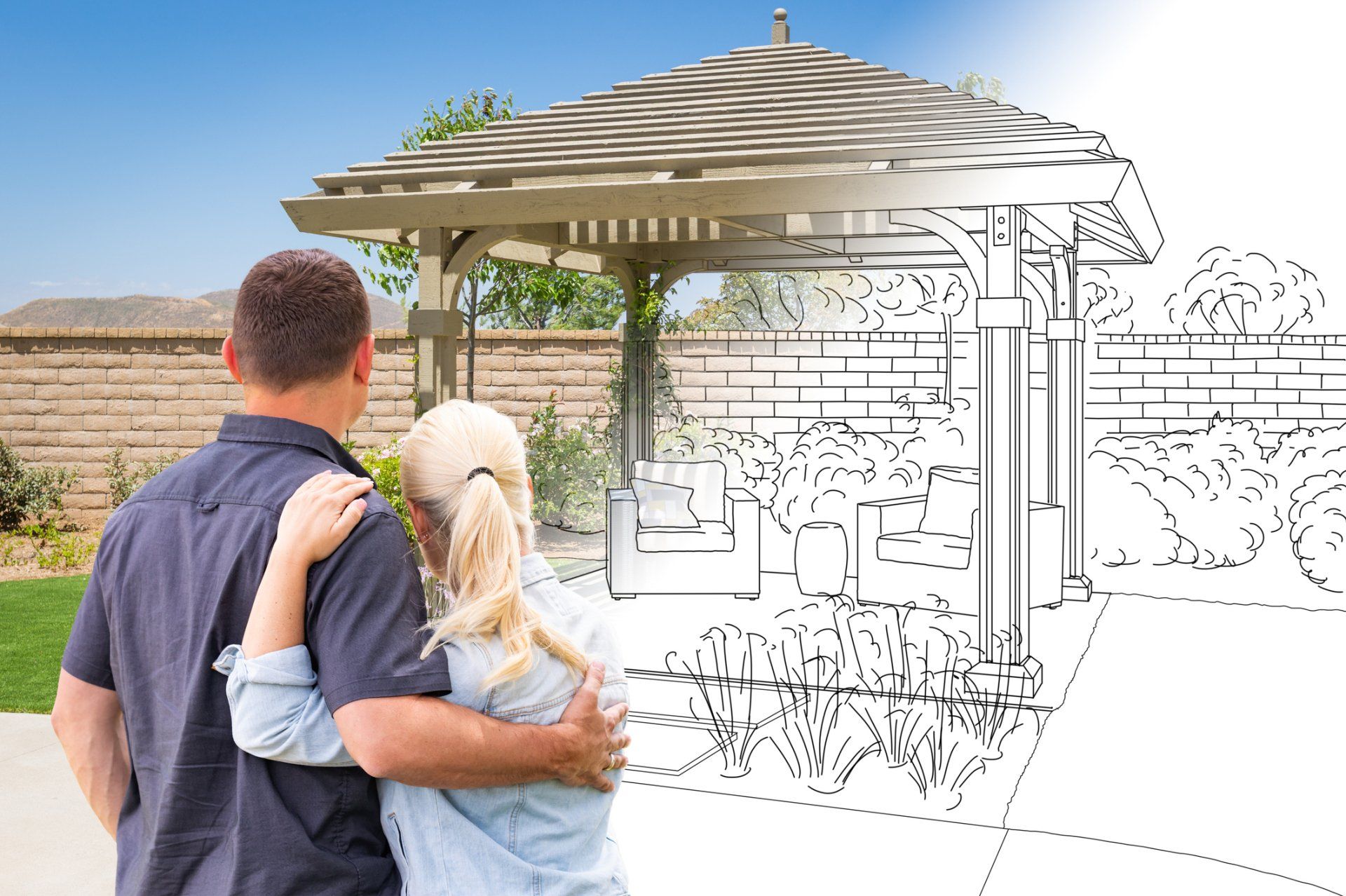 A man and woman are looking at a drawing of a pergola.