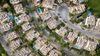 An aerial view of a residential area with lots of houses and trees.