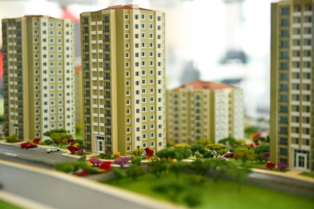 A model of a city with lots of buildings and trees
