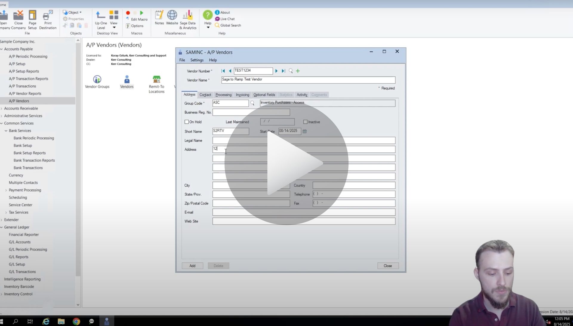 Man demonstrating software with an open window displaying data entry fields.