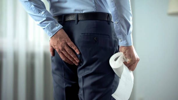 A man experiencing rectal discomfort who could benefit from hemorrhoid non-surgical treatment. – Milwaukee, OR – The Oregon Hemorrhoid Clinic