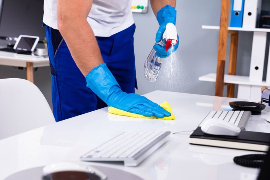 Cleaning White Office Desk — Shane’s Car Detailing & Office Cleaning in Taminda, NSW