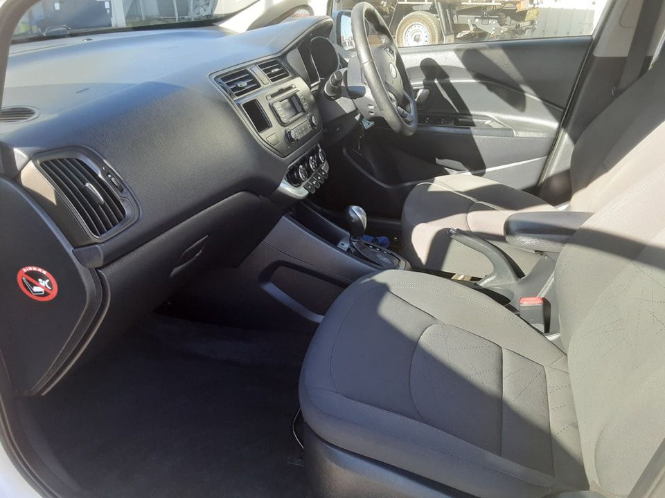 The Interior of a White Car With Black Seats and a Steering Wheel — Shane’s Car Detailing & Office Cleaning in Taminda, NSW