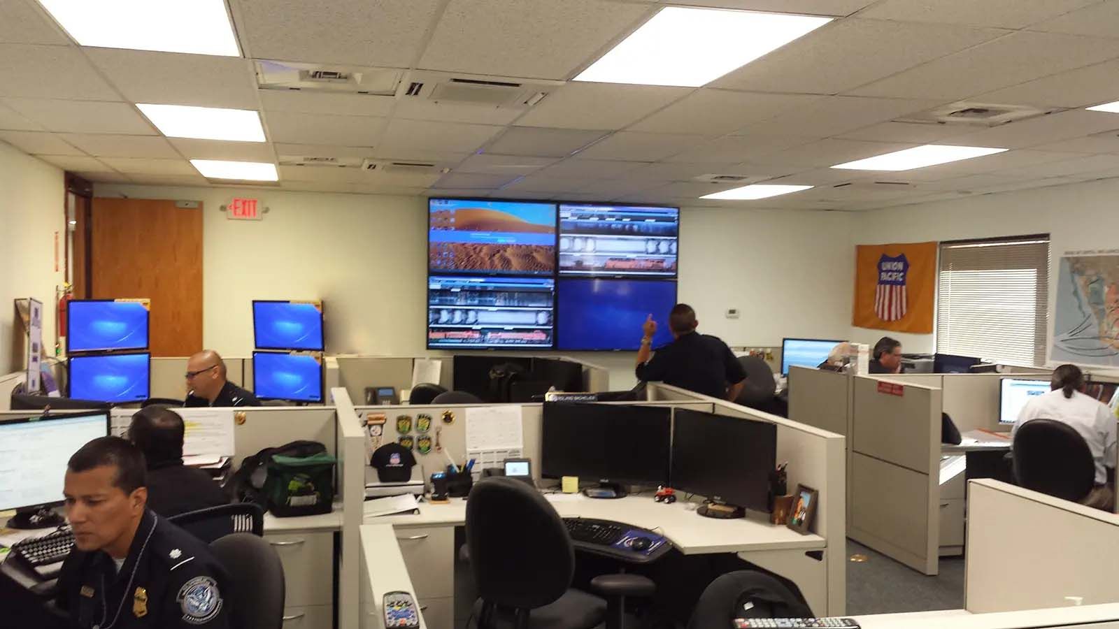 A group of police officers are working in an office