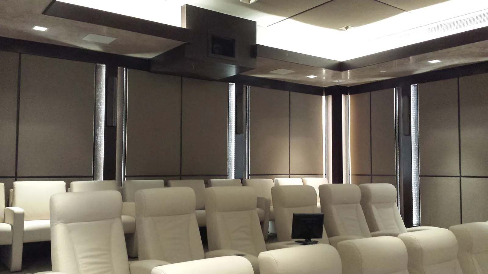 A conference room with a lot of chairs and a projector