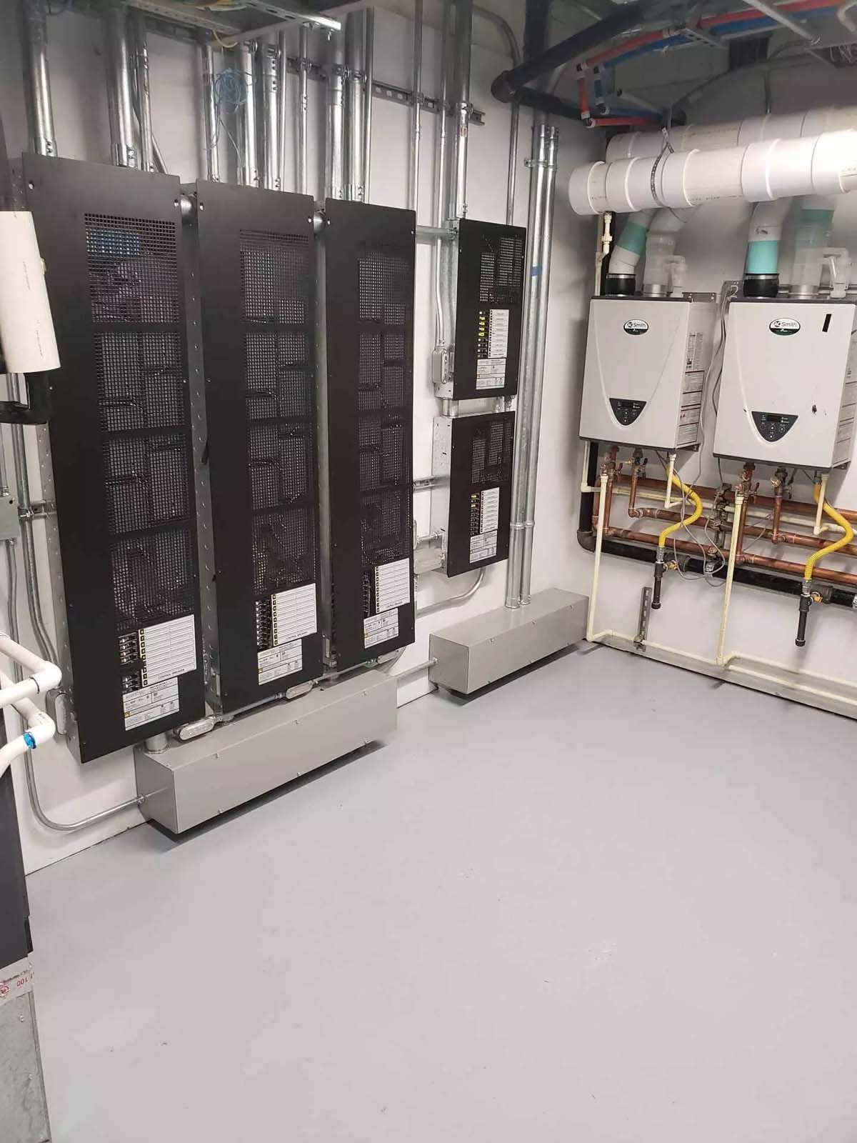 A room with a lot of electrical equipment in it.