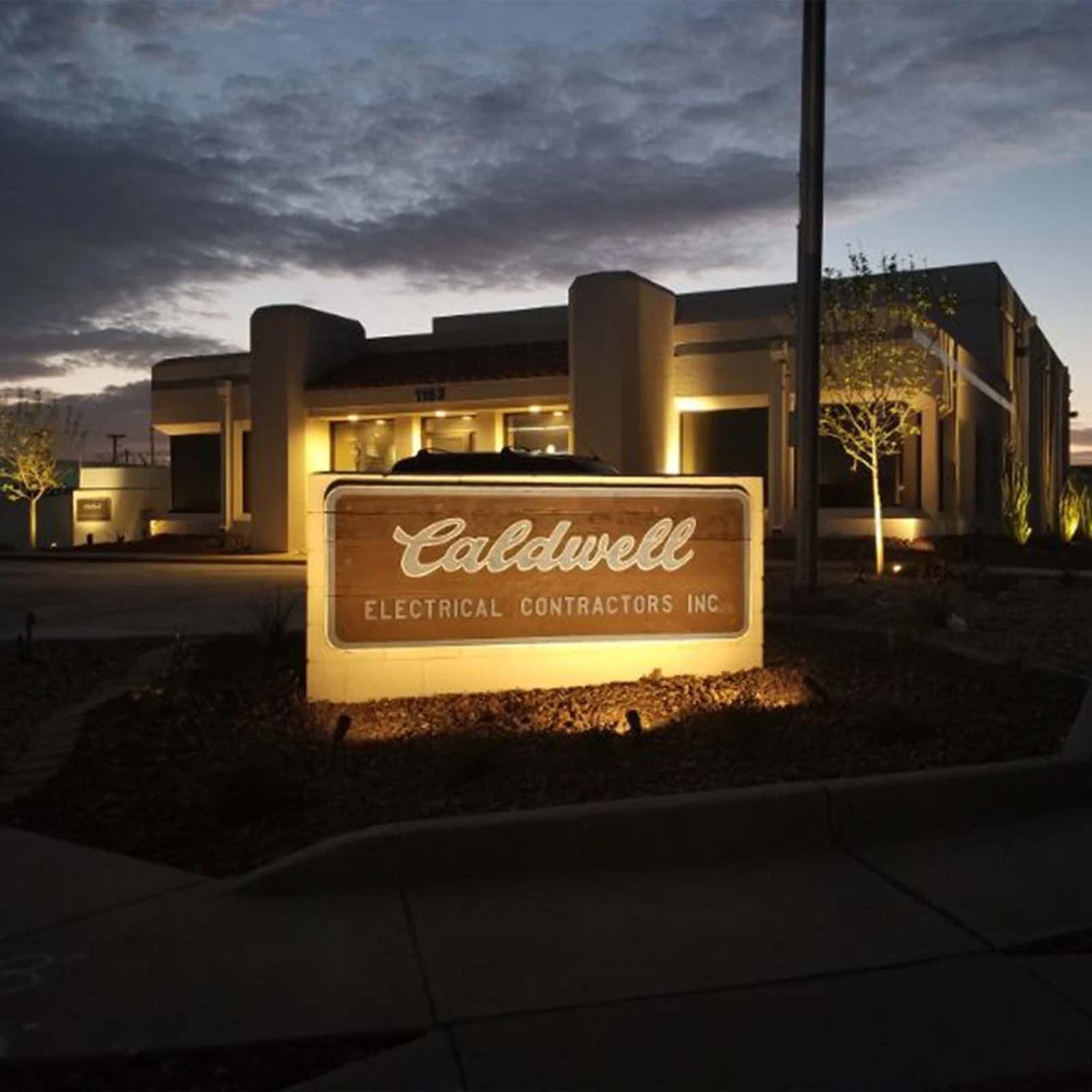 A building with a sign that says caldwell electrical contractors inc