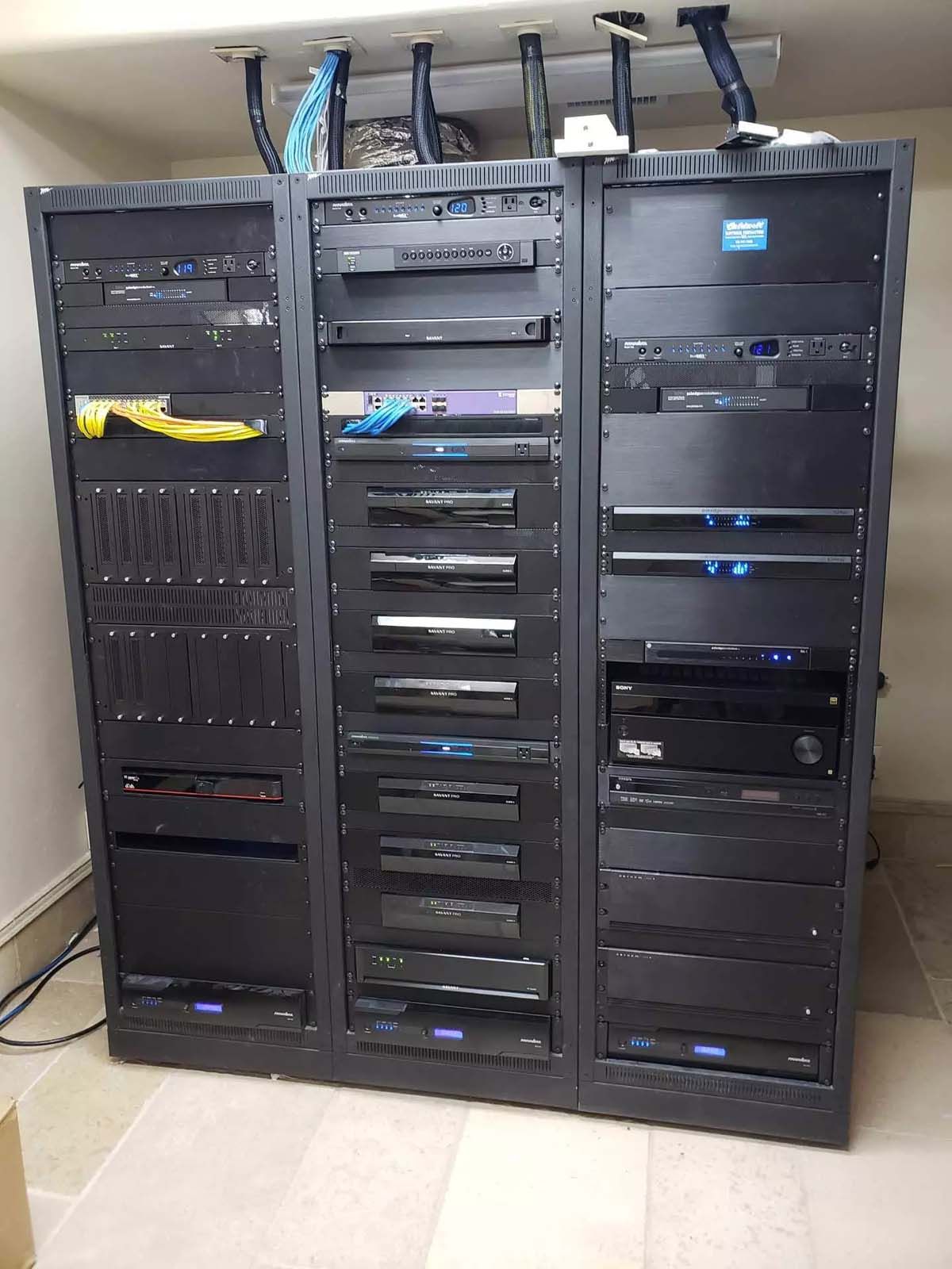 A large server rack filled with lots of computer equipment.